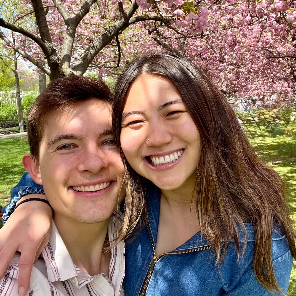 Adair and Caty under a cherry blossom tree